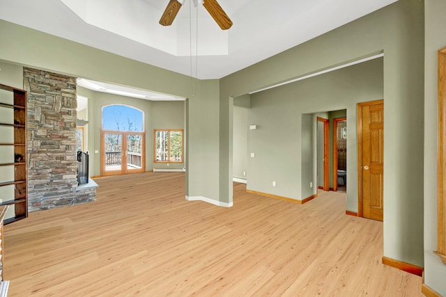 64 Turtle Cove Dr, Southampton, NY 11968 - unfurnished living room featuring baseboards, ceiling fan, and wood finished floors