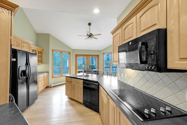 64 Turtle Cove Dr, Southampton, NY 11968 - kitchen featuring light brown cabinets, black appliances, and a baseboard radiator