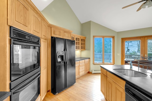 64 Turtle Cove Dr, Southampton, NY 11968 - kitchen featuring lofted ceiling, a sink, dark countertops, light brown cabinets, and black appliances