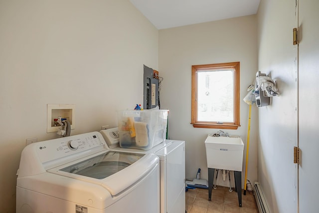64 Turtle Cove Dr, Southampton, NY 11968 - washroom with light tile patterned flooring, laundry area, washer and dryer, and a baseboard radiator