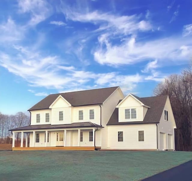 28 Peale Pl, Montgomery, NY 12549 - view of front facade featuring a front lawn, driveway, an attached garage, and a porch