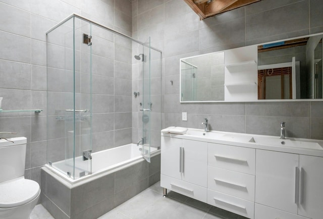 14 Perry Ct, Armonk, NY 10504 - bathroom featuring tile walls, tiled shower / bath combo, double vanity, and tile patterned floors
