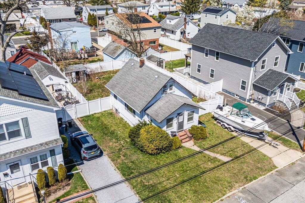 birds eye view of property with a residential view