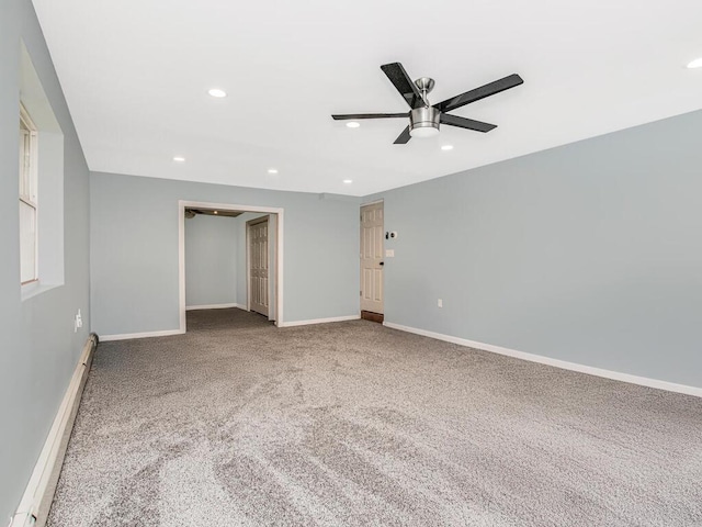 unfurnished bedroom featuring a baseboard radiator, carpet flooring, recessed lighting, baseboards, and ceiling fan