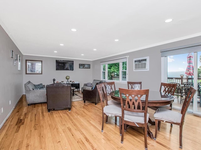 dining area with light wood-style flooring, ornamental molding, recessed lighting, and baseboards
