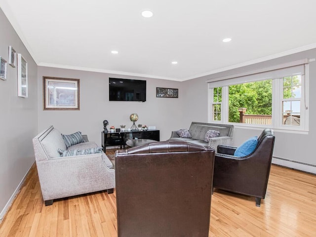 living room featuring light wood-style flooring, a baseboard heating unit, ornamental molding, baseboards, and recessed lighting