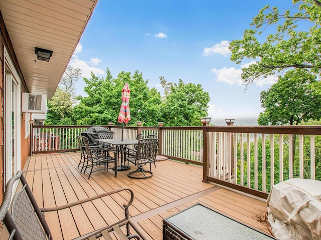 wooden terrace featuring outdoor dining area