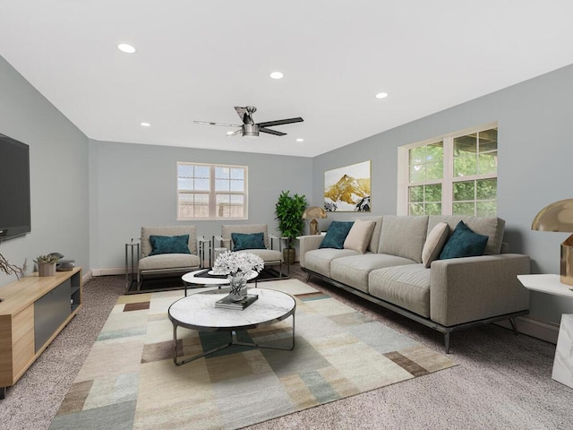living area with ceiling fan, light carpet, recessed lighting, and baseboards