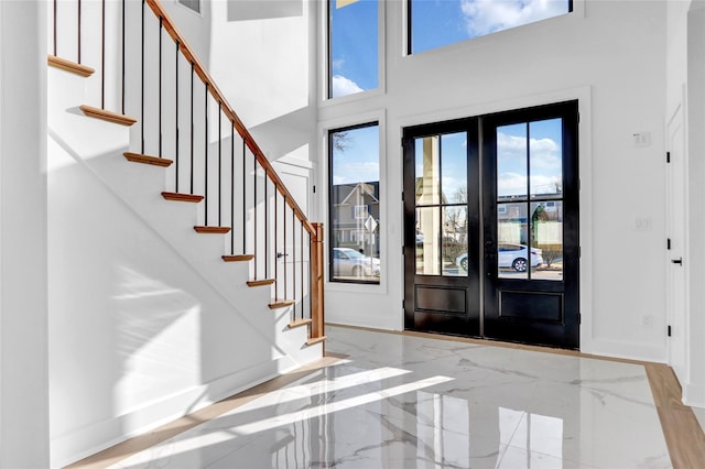 3585 Martha Blvd, Bethpage, NY 11714 - entryway featuring marble finish floor, stairs, and french doors
