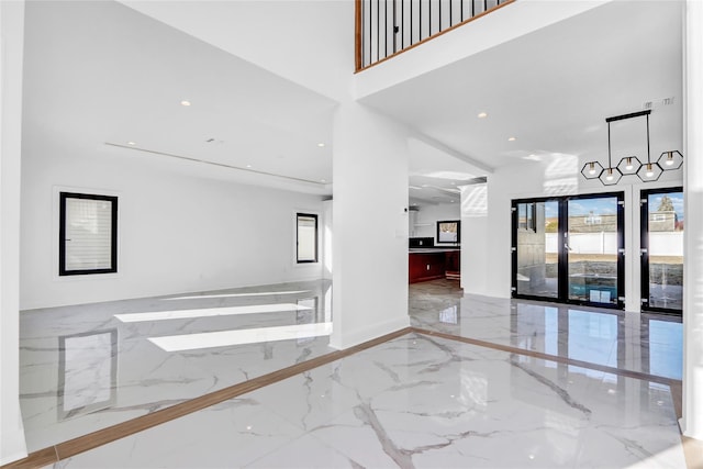 3585 Martha Blvd, Bethpage, NY 11714 - interior space with baseboards, marble finish floor, a towering ceiling, and recessed lighting