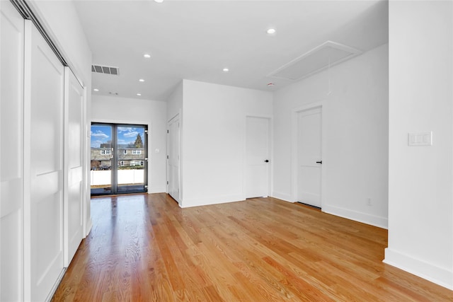3585 Martha Blvd, Bethpage, NY 11714 - unfurnished room with visible vents, light wood finished floors, baseboards, recessed lighting, and attic access