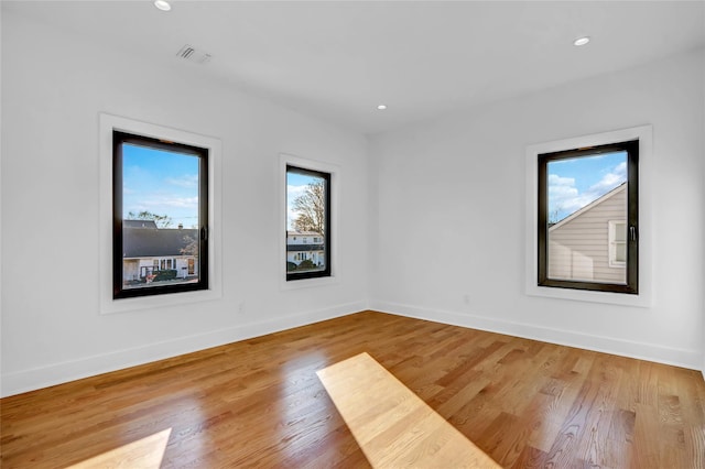 3585 Martha Blvd, Bethpage, NY 11714 - empty room with wood finished floors, baseboards, and visible vents