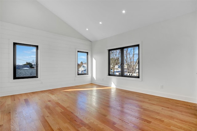 3585 Martha Blvd, Bethpage, NY 11714 - unfurnished room with recessed lighting, high vaulted ceiling, baseboards, and wood finished floors