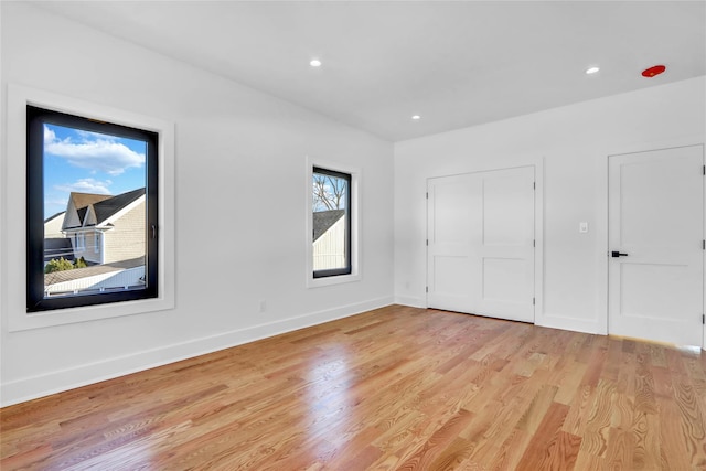 3585 Martha Blvd, Bethpage, NY 11714 - unfurnished bedroom with light wood finished floors, baseboards, and recessed lighting