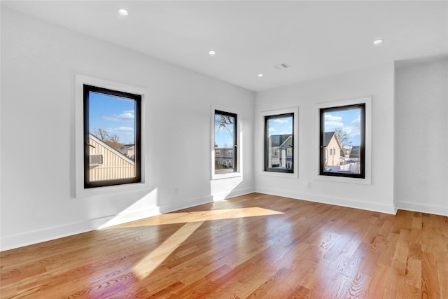 3585 Martha Blvd, Bethpage, NY 11714 - empty room with visible vents, wood finished floors, recessed lighting, and plenty of natural light