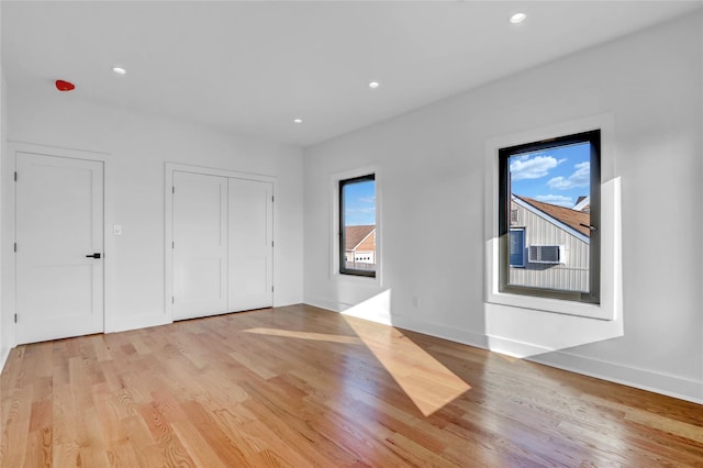3585 Martha Blvd, Bethpage, NY 11714 - interior space featuring baseboards, recessed lighting, light wood-style floors, and cooling unit