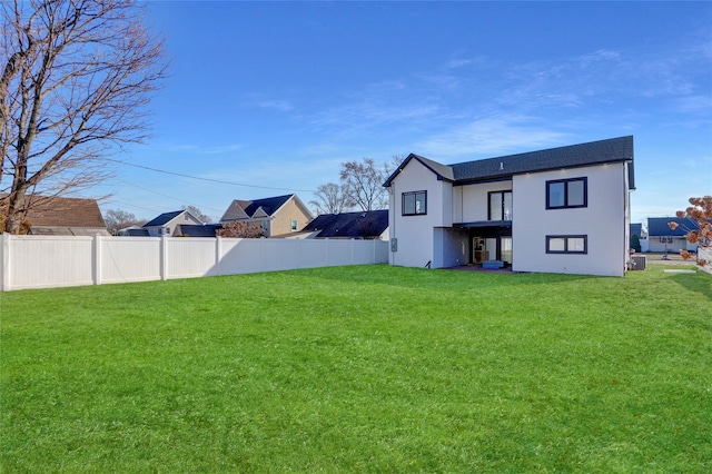 3585 Martha Blvd, Bethpage, NY 11714 - back of property with fence and a yard