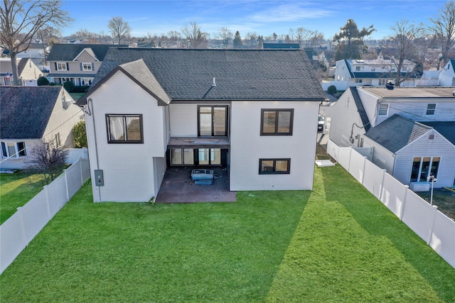 3585 Martha Blvd, Bethpage, NY 11714 - rear view of house with a residential view, a fenced backyard, a yard, and a patio area