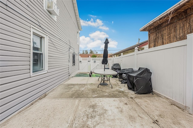 view of patio featuring a fenced backyard and a gate