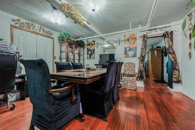 dining area with wood finished floors