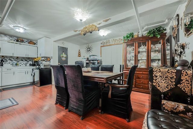 dining space featuring wood finished floors