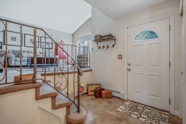 entrance foyer with vaulted ceiling, stairs, and a baseboard radiator