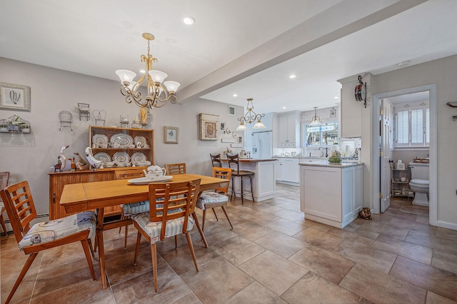 dining area featuring baseboards, visible vents, recessed lighting, and a chandelier