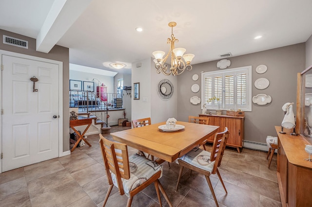 dining space featuring baseboard heating, a healthy amount of sunlight, a chandelier, and visible vents