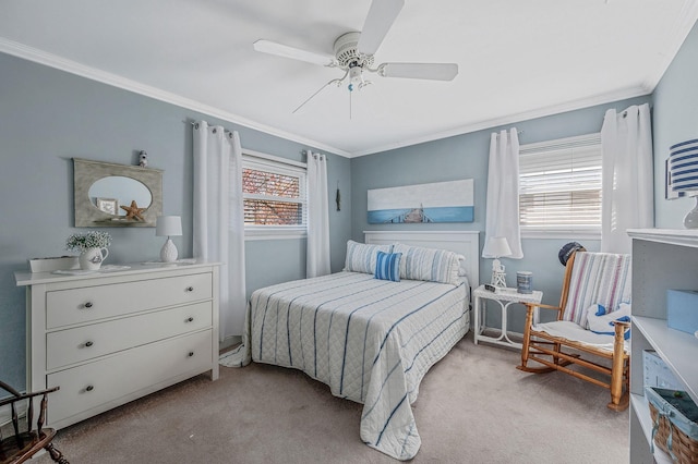 bedroom featuring ceiling fan, ornamental molding, and light colored carpet