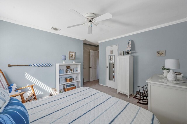 carpeted bedroom with a ceiling fan, visible vents, and crown molding