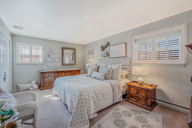 bedroom featuring a baseboard radiator, a closet, visible vents, and light colored carpet