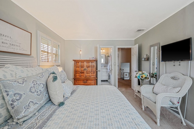 carpeted bedroom with connected bathroom, crown molding, and visible vents