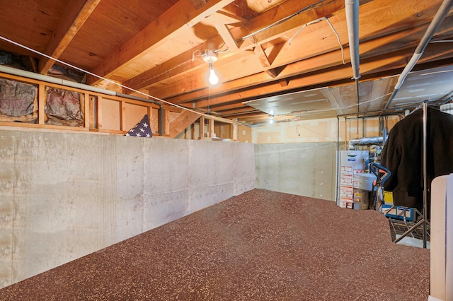 unfinished below grade area featuring gas water heater