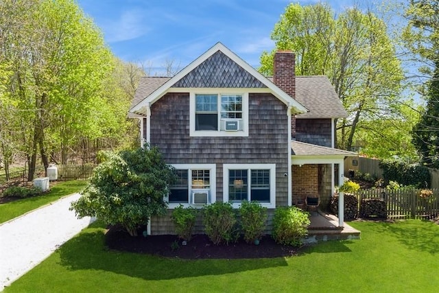 3320 Oregon Rd, Mattituck, NY 11952 - rear view of property featuring a chimney and a shingled roof