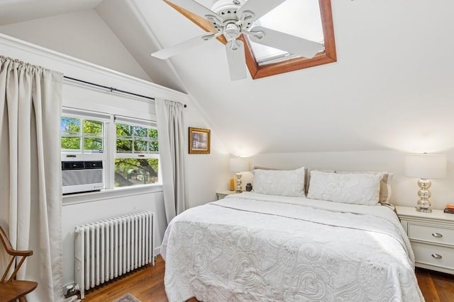 3320 Oregon Rd, Mattituck, NY 11952 - bedroom featuring radiator, lofted ceiling, wood finished floors, cooling unit, and a skylight