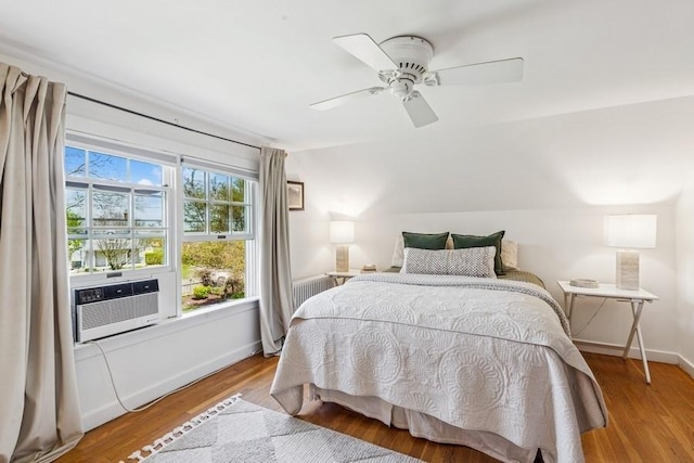 3320 Oregon Rd, Mattituck, NY 11952 - bedroom featuring cooling unit, wood finished floors, baseboards, and ceiling fan