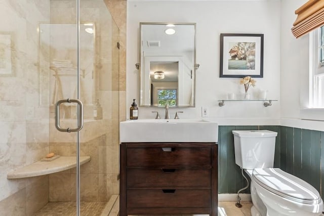 3320 Oregon Rd, Mattituck, NY 11952 - full bath featuring a shower stall, toilet, vanity, and wainscoting