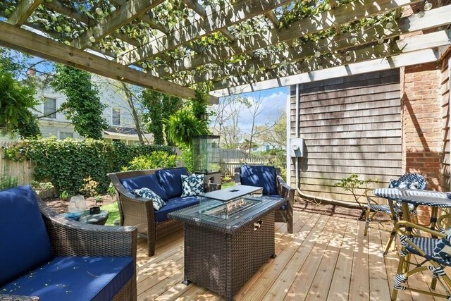 3320 Oregon Rd, Mattituck, NY 11952 - wooden terrace featuring outdoor lounge area, fence, and a pergola