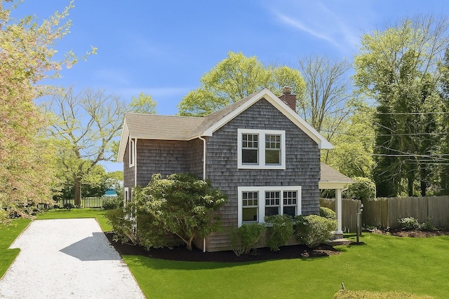 3320 Oregon Rd, Mattituck, NY 11952 - view of side of property with a chimney and a shingled roof