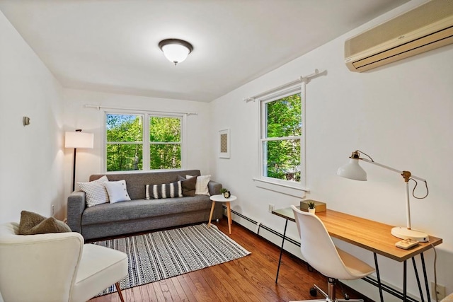 living room featuring a wall unit AC, a healthy amount of sunlight, hardwood / wood-style flooring, and a baseboard radiator