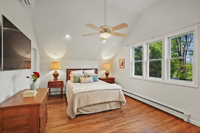 bedroom featuring light wood-style floors, a wall mounted AC, a baseboard heating unit, and lofted ceiling