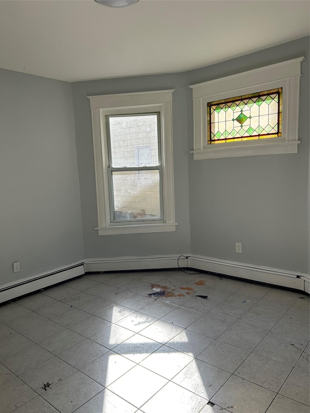 empty room featuring baseboards