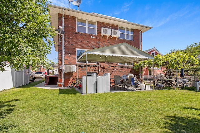 13506 62nd Rd, Flushing, NY 11367 - back of property featuring washer / clothes dryer, brick siding, a patio, ac unit, and a wall mounted air conditioner