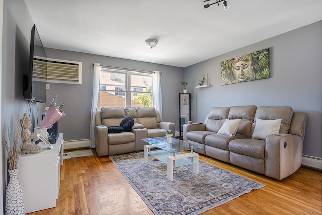 13506 62nd Rd, Flushing, NY 11367 - living area featuring light wood finished floors and a baseboard heating unit