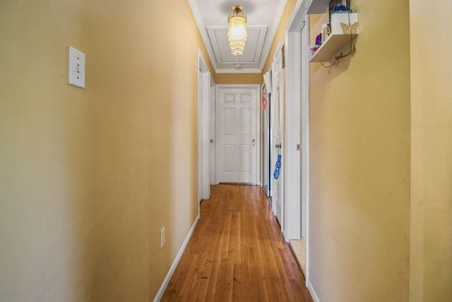 13506 62nd Rd, Flushing, NY 11367 - hall featuring attic access, baseboards, wood-type flooring, and crown molding