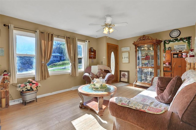 sitting room featuring light wood-style floors, ceiling fan, and baseboards