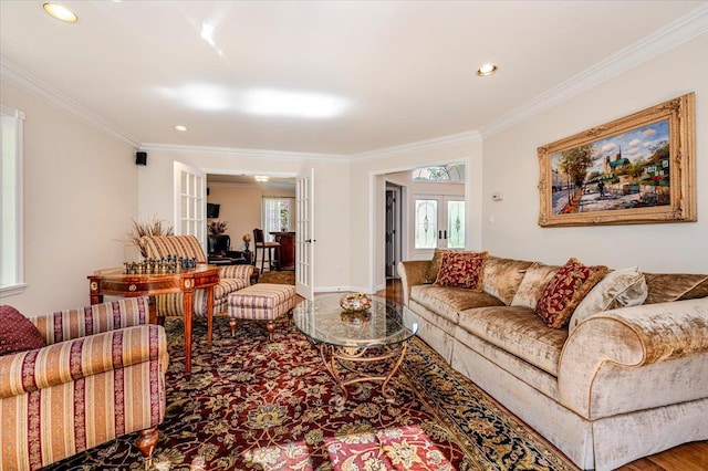 living room featuring crown molding, french doors, recessed lighting, and a healthy amount of sunlight