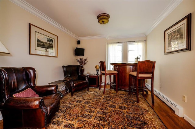 living area with crown molding, baseboards, wood finished floors, and baseboard heating