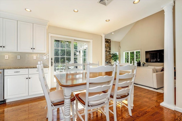 dining area featuring ornate columns, recessed lighting, visible vents, and light wood-type flooring