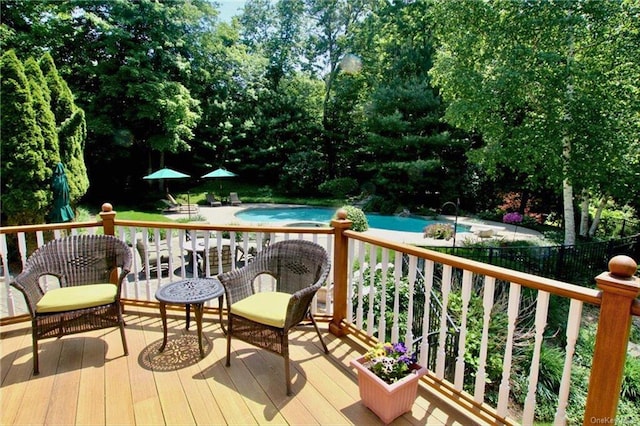 deck featuring an outdoor pool